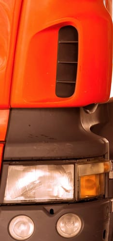 automobile-mechanic-checking-truck-in-the-garage-with-sunbeam-selective-focus-gm894186570-247254354
